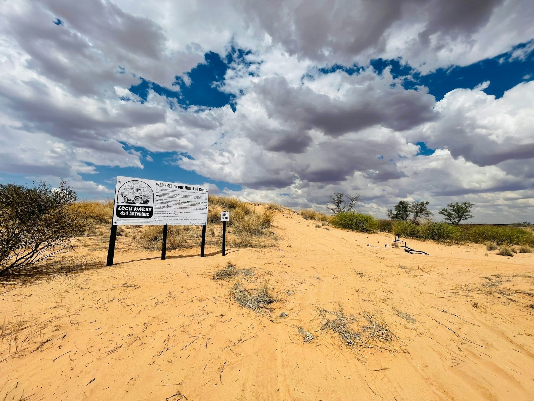 Loch Maree dune signage under a big Kalahari sky