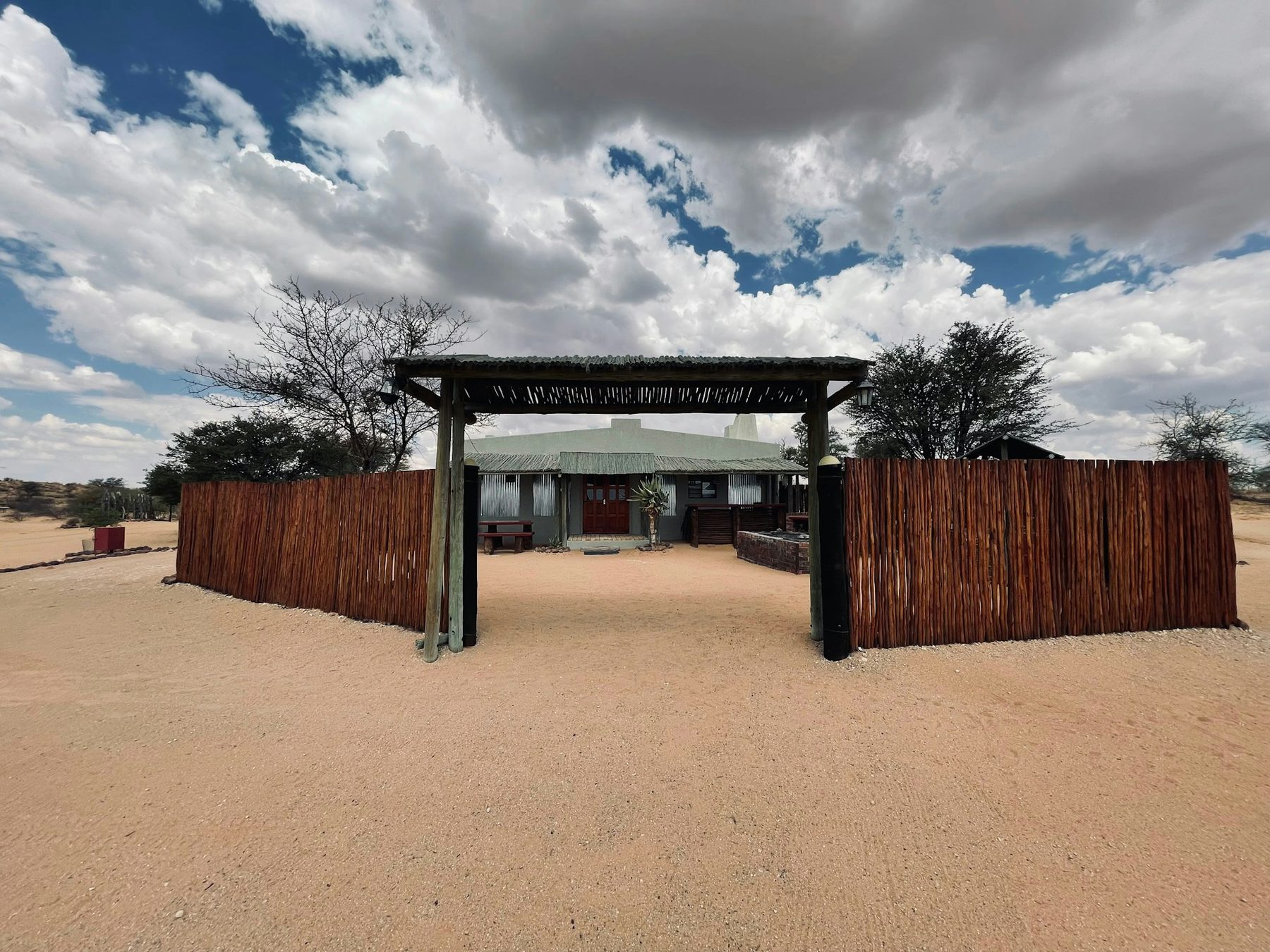 The field camp gate under big clouds