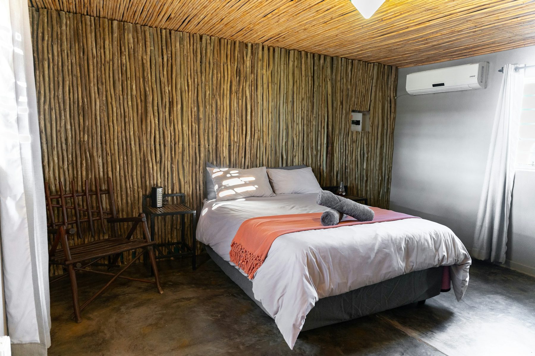 A double bed in a field camp hut