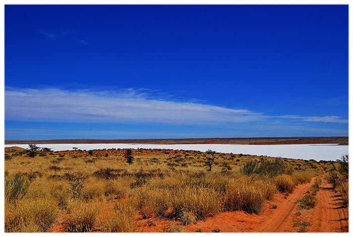 The white salt pan under a blue sky